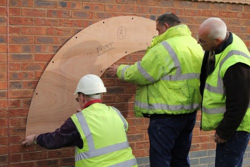 Two_bridges_-_installing_the_wooden_back_plate_for_king_williams_bridge