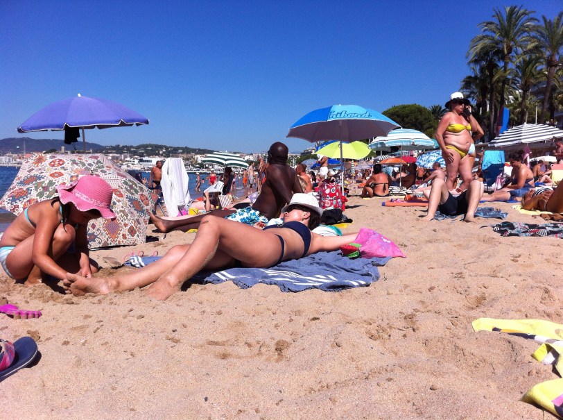 sun seekers on the public beach in Cannes France 2016
